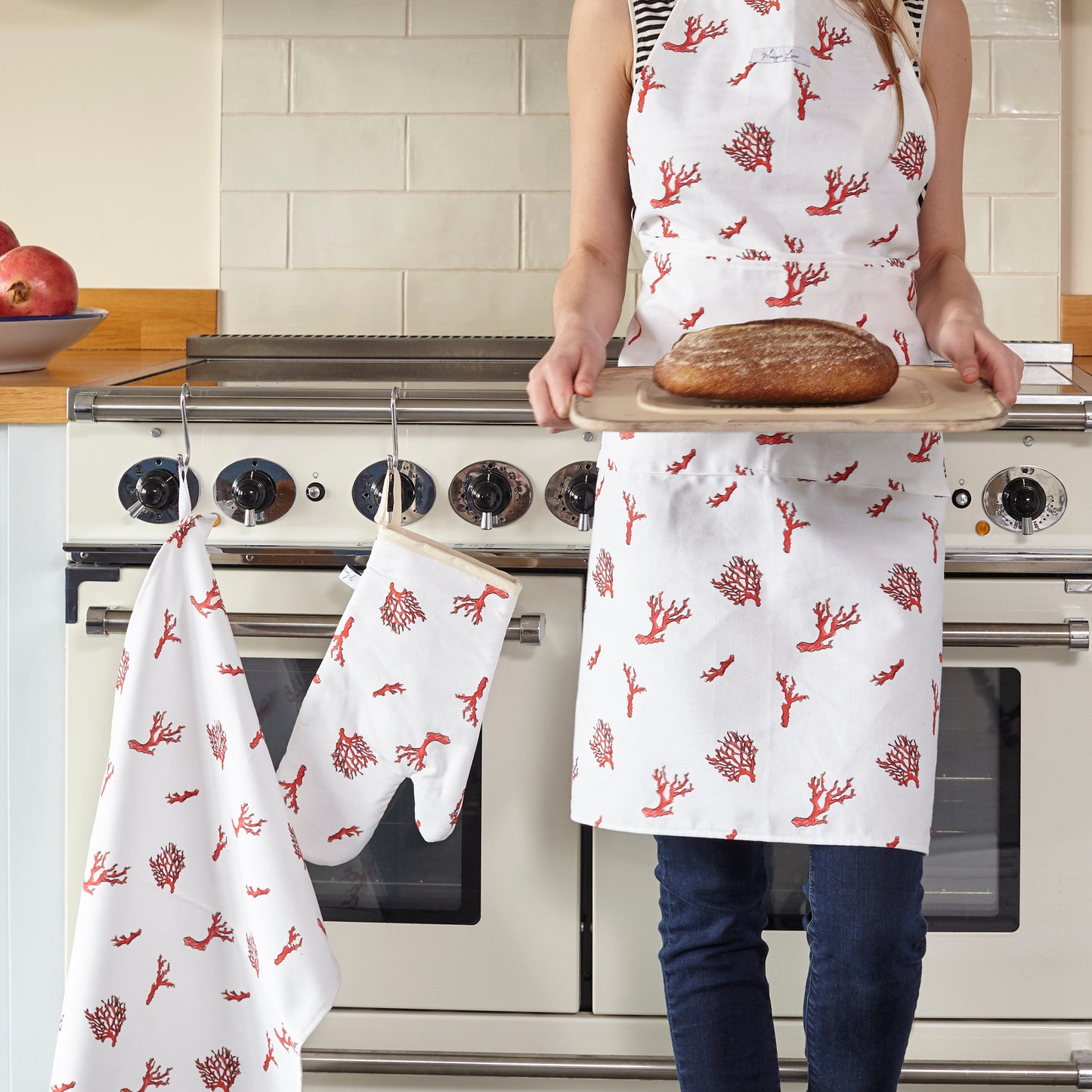 coral print apron , coral print oven glove and coral print tea towel in the kitchen 
