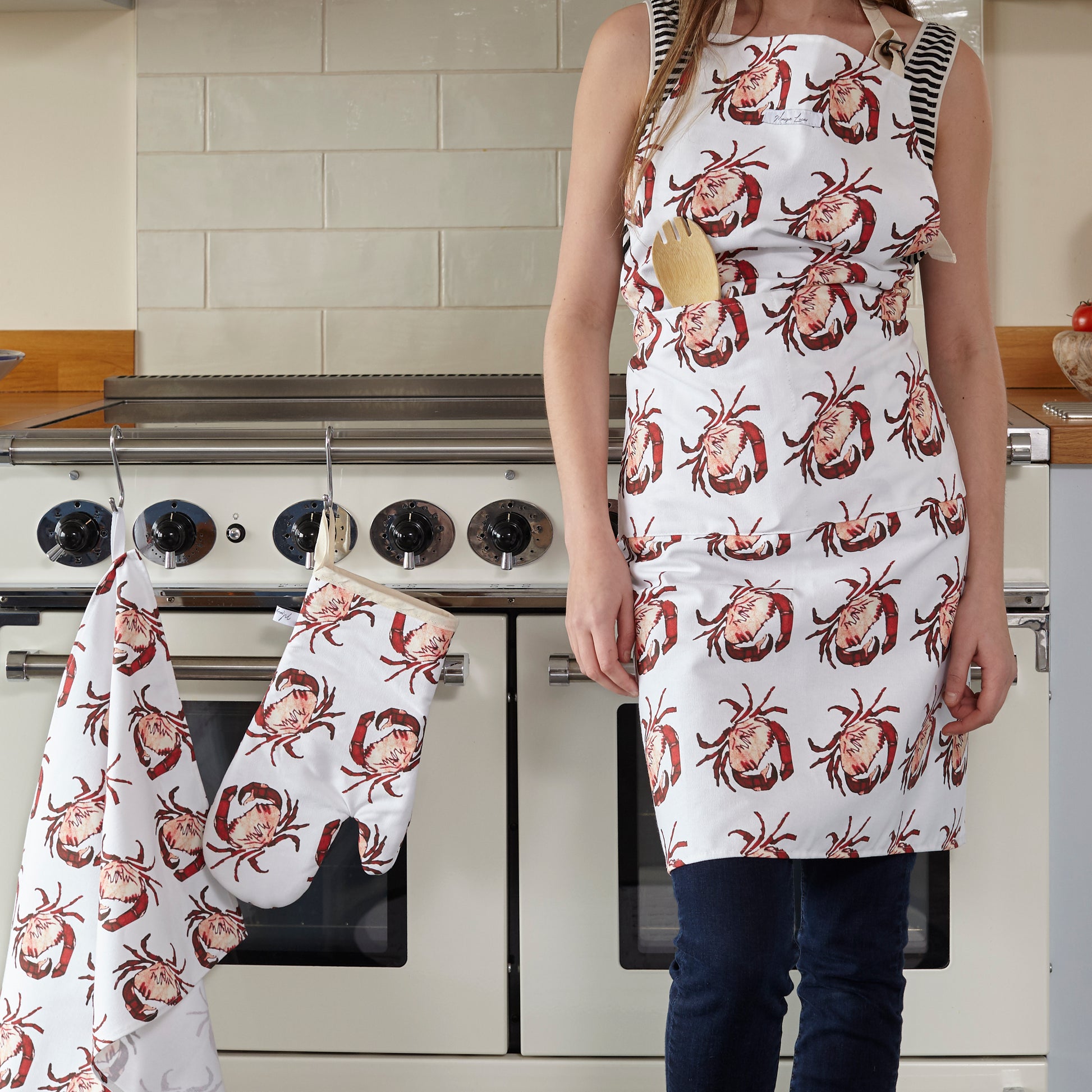 crab print apron , crab print oven glove and crab print tea towel in the kitchen