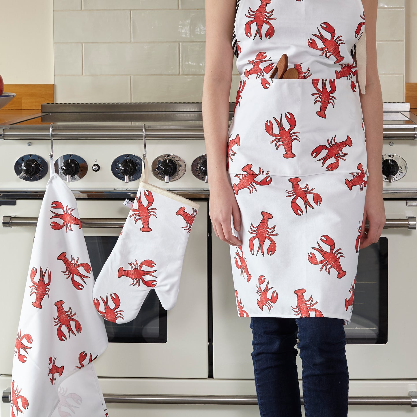lobster print apron , lobster oven glove and lobster tea towel in the kitchen